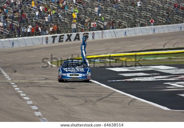FORT WORTH, TX - NOV 06:  Carl Edwards holds off Kyle\
Busch and the rest of the field to win the O\'Reilly Auto Parts\
Challenge race on NOV 6, 2010 at the Texas Motor Speedway in Fort\
Worth, TX.