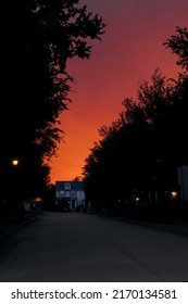 Fort Worth, TX USA - 05 13 2022: Sunset Of With Deep Red Glowing Sky In A Suburb With Duplex Houses Along A Quiet Street