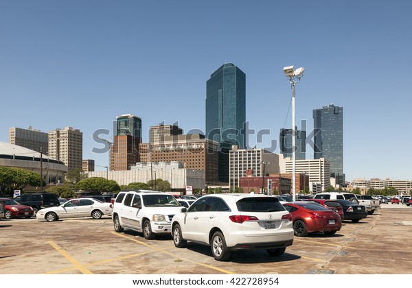 FORT WORTH, USA\
- APR 6, 2016: Cars on a parking lot in Fort Worth downtown\
district.  Texas, United\
States