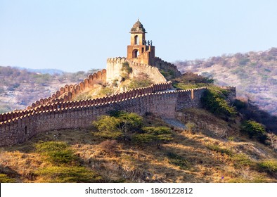 fortification with bastions of Jaigarh fort and Amer or Amber town  near Jaipur city India evening view