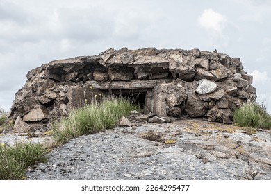 Fortifications of the Second World War in the Baltic. The bunker (pillbox) on the granite island is made of wild stones. Object suitable for military tourism - Shutterstock ID 2264295477