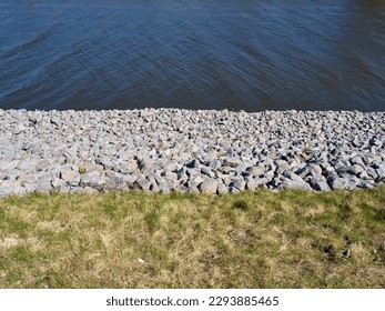 Fortified embankment of the river. Flood protection.