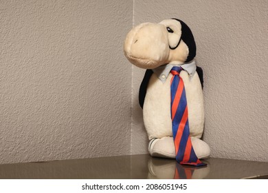 Fortuna, Missouri - November 28 2021: A 1980s Opus the Penguin stuffed animal on a desk in a home office.