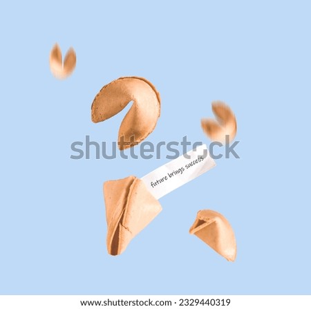 Fortune cookies fly on a blue background. Minimal art  prediction of success.