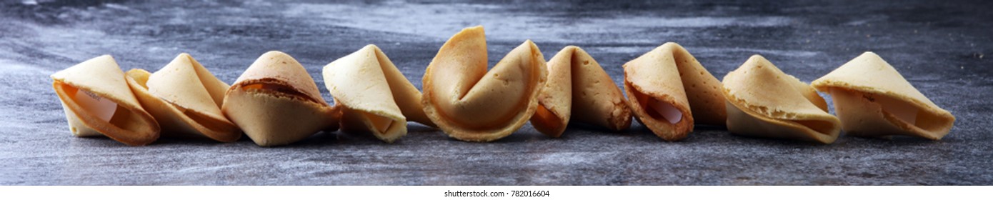 Fortune Cookies on dark background. Chinese cookie with wisdom. - Shutterstock ID 782016604