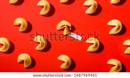 Fortune cookies on a red background, close-up.Сookies with prediction, pattern.
