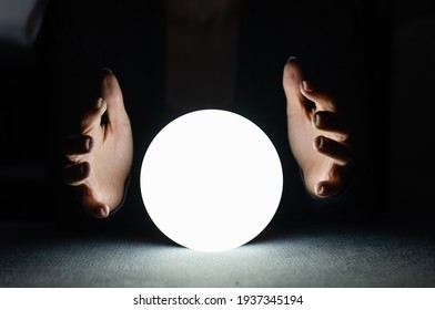 A Fortune Teller Gazes Into Her Ball