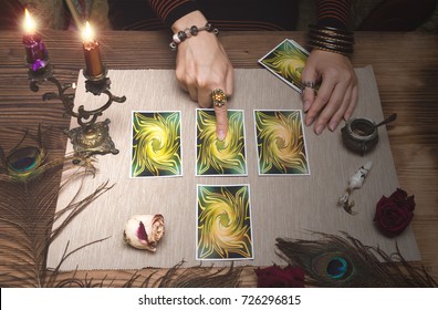 Fortune teller reading future by tarot cards on wooden table. - Shutterstock ID 726296815