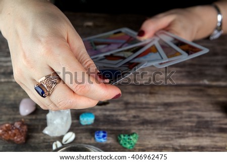 Fortune teller woman predicting future from cards