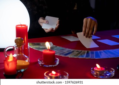 Fortune Teller Young Asian Woman Gypsy Glowing Crystal Ball, Tarot Cards, Magic, And Composition Esoteric Astrology Object To Predict Destiny Or Future. Superstition And Supernatural Phenomenon