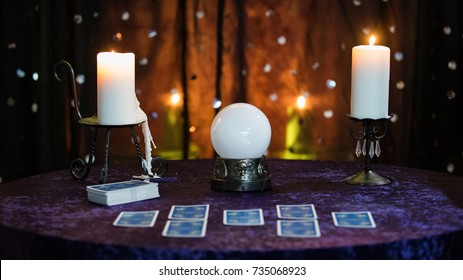 Fortune Telling Table with a crystal ball and tarot cards