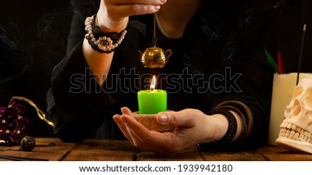Fortune-teller or oracle with objects for fortune-telling during the session. Psychic readings and the concept of clairvoyance.