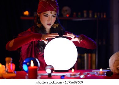 Fortune-teller Woman Is Predicting With A Shining Crystal Ball