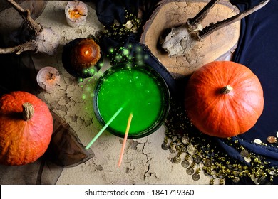 fortune-teller's table, witches covered with a black cloth, pumpkins lie, animal skulls, green witch's potion, candles are burning, the concept of Halloween, love spell, clairvoyance - Shutterstock ID 1841719360