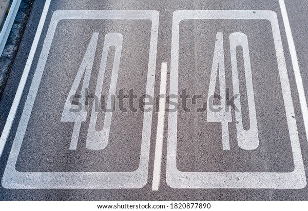 Forty Kilometers or Miles Per Hour Speed Limit Sign\
in Road Paint. Top view