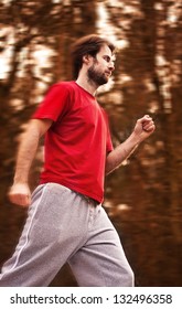 Forty Years Old Man During A Running Workout In Autumn Forest