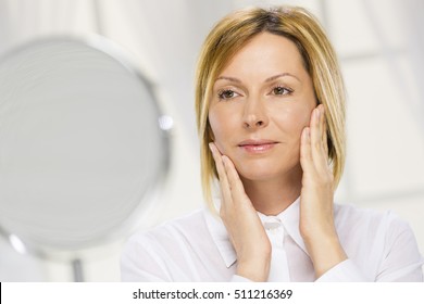 Forty Years Old Woman And Mirror