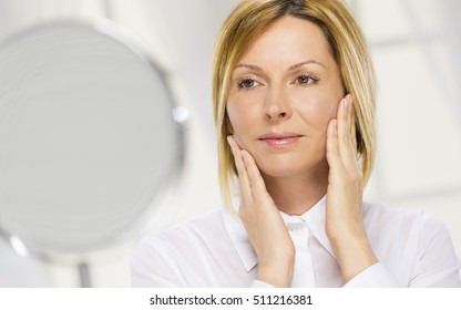 Forty Years Old Woman And Mirror