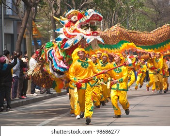 FOSHAN, MARCH 23: Dragon Dance In The Parade To Celebrate The Birthday Of Thetemple Of God, Foshan Temple Organized A Parade Of The Intangible Cultural Heritage March 23, 2012 in Foshan, China