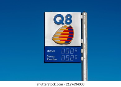 Fossano, Italy - February 26, 2022: Q8 Logo Sign With Fuel Euro Price Display On Gas Station On Blue Sky, It Is Brand Of Kuwait Petroleum International. Expensive Fuel Price Concept. Copy Space