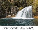 Fossil Creek Falls.  Calcium carbonate gives the water its distinctive color and causes the creation of copious amounts of travertine.