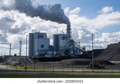 Fossil Fuel (coal) Power Station And Wind Turbines In The Eemshaven Generating Power.