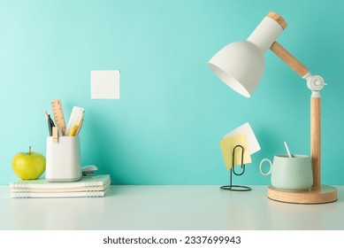 Foster a focused study environment with this side-view picture of white desktop with school supplies, penholder and desk lamp on a blue isolated background, designed for easy text or ad placement - Powered by Shutterstock