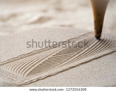 Similar – Hand im Sand Lifestyle