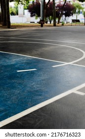 Foul Line - Free Throw Line Of A Blue And Black Public Basketball Court. It Is In A Large Outdoor Park. The Court Is Empty. Image For Wallpaper. Sports Concept.