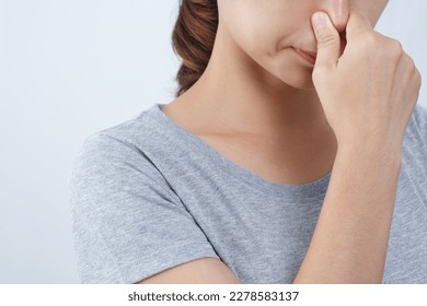 A foul smell when breathing may be caused by. 1. Infections in the nasal cavity such as colds, flu, sinusitis. - Shutterstock ID 2278583137