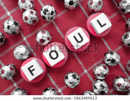 Foul, word cube with background.