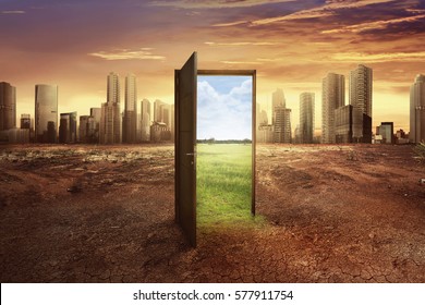 Found new world with green environment from open wooden door against cityscape background - Shutterstock ID 577911754