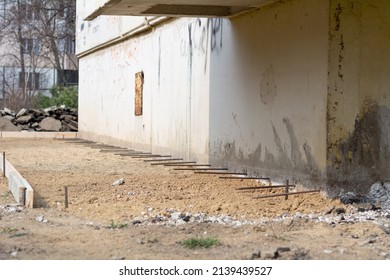 Foundation blind area preparing. Basic formwork marking. Blind area construction near the house.