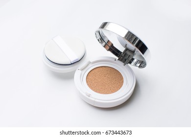 foundation cushion with sponge and puff, white background