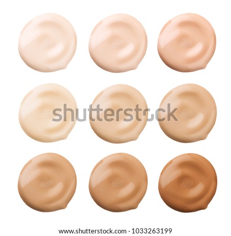 Foundation face make-up samples. Set of cosmetic liquid foundation or cream in different colour smudge smear strokes. Make up smears isolated on a white background. Foundation colors palette