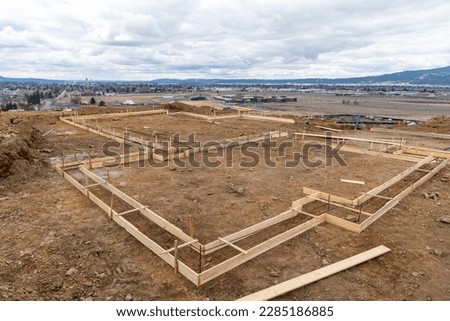 The foundation for a new construction hillside view home overlooking the cities of Spokane, Washington and the Spokane Valley, USA.