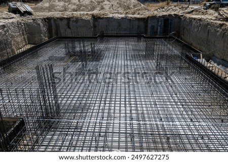Foundation of a new house with reinforced concrete. Urban construction buildings foundation.