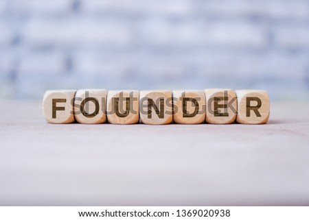 Founder word written on wood block