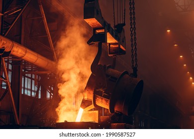 Foundry. Metal Cast Process. Molten Iron Pouring With Sparks And Smoke In Metallurgical Plant