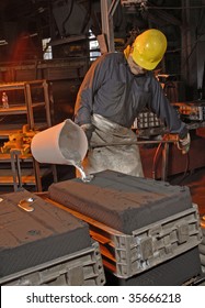 Foundry worker pouring aluminum - Shutterstock ID 35666218