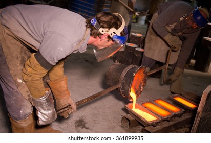 Foundry Worker Pouring Hot Metal Into Cast