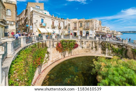 The Fountain of Arethusa and Siracusa (Syracuse) in a sunny summer day. Sicily, Italy.
