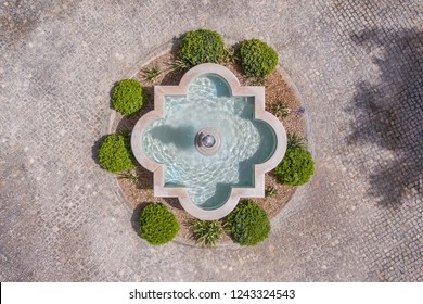 Fountain In The Garden Of Cobblestones, Shot From Above From The Sky, Drone.