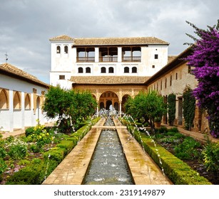 Fountain and garden of Generalife Palace in the Alhambra of Granada, Andalusia, Spain. World Heritage site by Unesco - Powered by Shutterstock