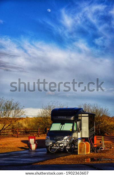 Fountain Hills,\
AZ January 25 2021: RV Travel Trailers and Motorhomes at an RV Park\
in Arizona with Natural\
Daylight