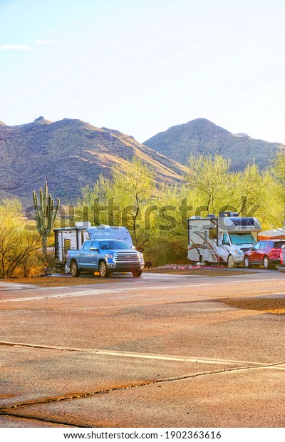 Fountain Hills,\
AZ January 25 2021: RV Travel Trailers and Motorhomes at an RV Park\
in Arizona with Natural\
Daylight