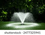 Fountain in the middle of the lake under sunlight