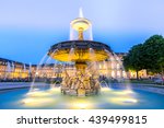 Fountain at neues Schloss New palace in Stuttgart city center, Germany at dusk