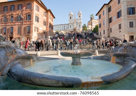 fountain on Spanish square with Spanish Steps on background, Rome