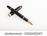 Fountain pen, beautiful fountain pen positioned on white background, selective focus.